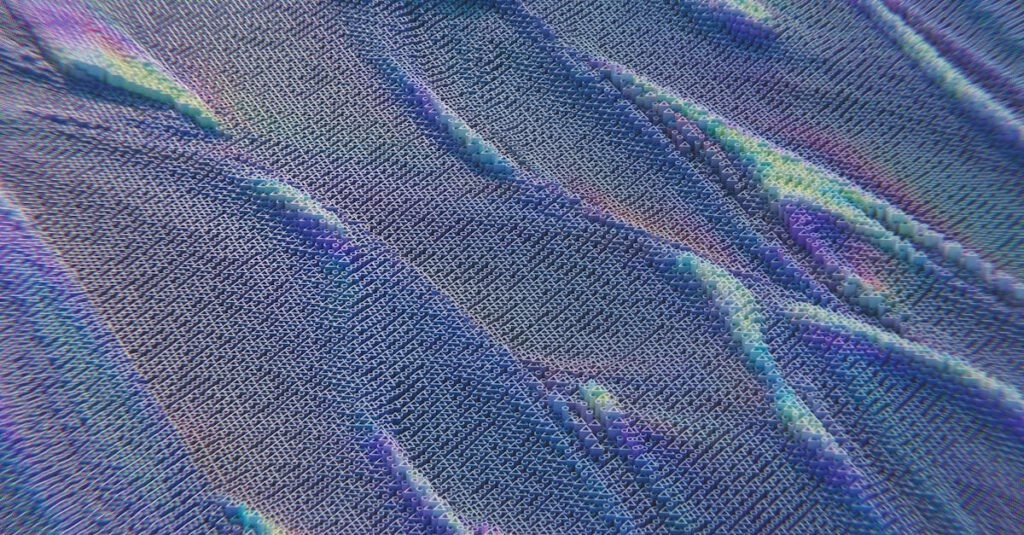 Colorful abstract pattern resembling digital waves with intricate texture in blue and purple hues.